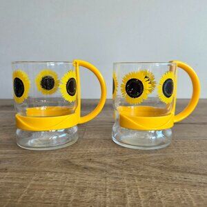2 vintage sunflower glass coffee or tea cups/mugs/glasses with yellow handles.